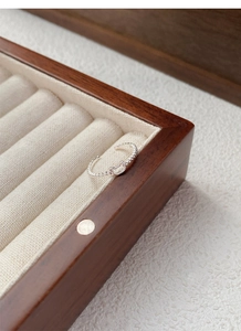 Macro view of silver hollow bear ring on a velvet jewelry box highlighting the detail