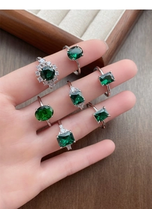 Close-up of S925 silver rings with emerald cut cubic zirconia in various geometric shapes