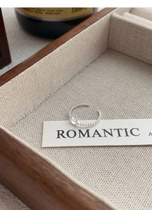 S925 sterling silver hollow bear ring displayed in a wooden jewelry box with beige lining