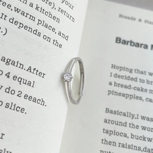 Minimalist S999 silver six-prong adjustable ring with a brilliant round cubic zirconia