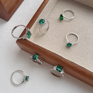 Set of six S925 silver rings with emerald green zircon stones in geometric cuts
