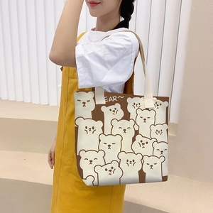 Minimalist canvas tote bag with cartoon bear pattern and adjustable shoulder strap for women