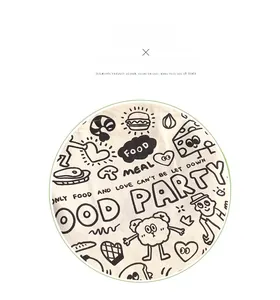 Detail of the cartoon print on the cream canvas tote bag with food party graphics