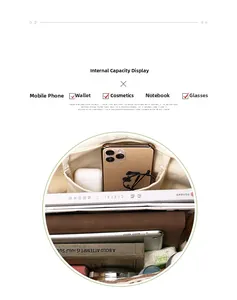 Spacious interior of beige canvas tote bag holding books, phone, and daily essentials