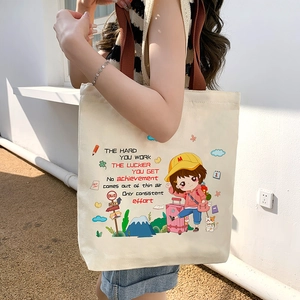 Sac fourre-tout en toile blanc cassé avec motif fille de dessin animé et anses brunes