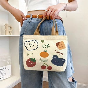 Minimalist beige canvas tote bag with cute bear and fruit illustrations for daily commute