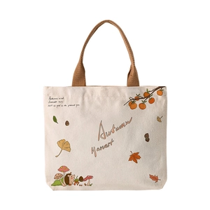 Minimalist cream canvas tote bag with Autumn Harvest illustration and brown woven handles