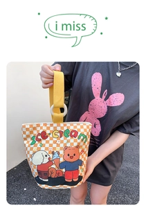 Outdoor view of yellow checkerboard canvas bucket bag with cute cartoon ice cream print