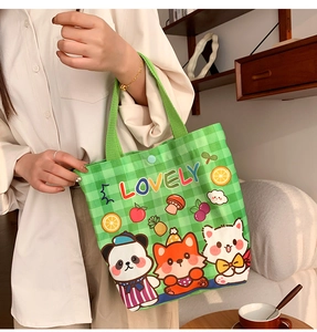 Detail of green checkered canvas tote with cute animal prints and snap button closure