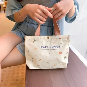 Minimalist canvas handbag with geometric prints and fabric handles for daily casual use