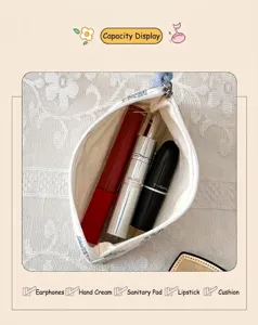 Detailed interior of a floral cotton mini pouch storing lipstick and earphones