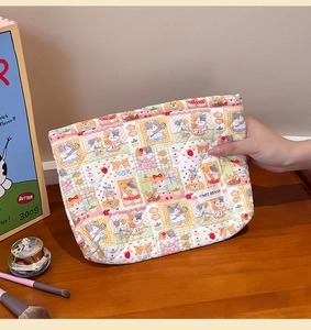 Quilted floral makeup bag with cute cat prints and a premium white logo label detail