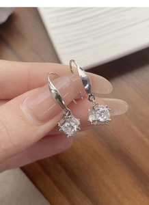 Close-up of S925 sterling silver geometric cube earrings with sparkling micro-inlaid stones