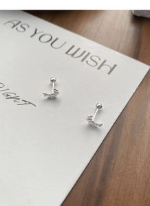 Detailed view of S999 silver croissant stud earrings with secure screw ball back closure