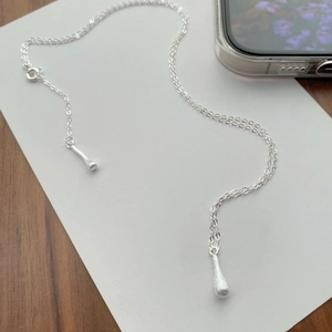 Minimalist S925 sterling silver necklace with matte finish and water drop tassel pendants