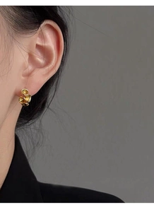 Detail view of S925 silver ruffled edge stud earrings with elegant gold matte finish
