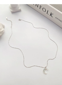 Close-up of S925 sterling silver crescent moon necklace with white mother of pearl inlay