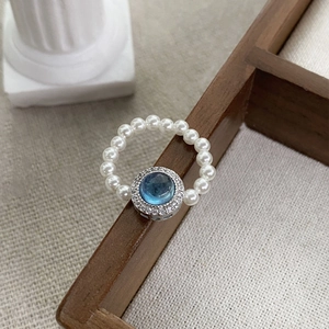 S925 silver aquamarine gemstone ring with pearl band on vintage aesthetic background