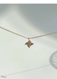 Detailed view of S925 sterling silver windmill necklace with zircon pavé stones
