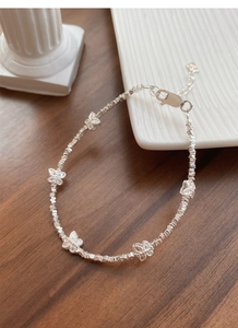 Detailed shot of S925 silver butterfly bracelet with faceted beads and lobster clasp