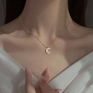 Elegant S925 sterling silver moon necklace with mother of pearl inlay worn by a model
