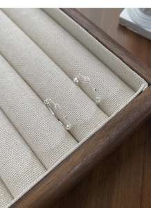 Detailed macro shot of S925 sterling silver hollow heart rings on a jewelry tray