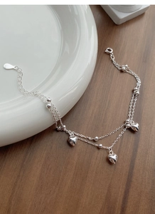 Detailed close-up of double-layer S925 sterling silver heart bracelet with lobster clasp