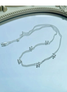 Detailed macro view of S925 sterling silver cherry pendant on elegant double-layered chain