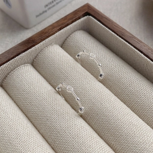 Minimalist S925 sterling silver open heart ring displayed in a wooden jewelry box