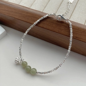 S925 sterling silver bracelet featuring green jade beads and delicate lotus flower charm