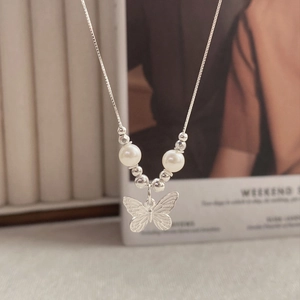 Elegant S925 sterling silver butterfly necklace featuring white pearls on a simple chain