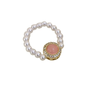 Elegant S925 silver pearl stretch ring with pink gemstone and crystal halo in gold finish