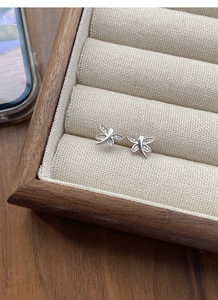 Close-up of S925 sterling silver dragonfly stud earrings with shimmering zircon pavé wings