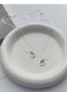 Detail view of S925 sterling silver stamp on the pink oval gemstone necklace chain