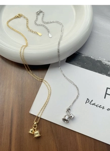 Detail of silver and gold Lily of the Valley bell pendants on S925 sterling silver chain