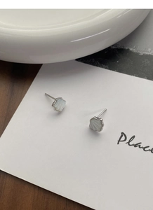 Macro shot of S925 sterling silver shell earrings with white mother of pearl inlay