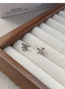 Macro shot of S925 sterling silver dragonfly stud earrings with micro-pave crystals