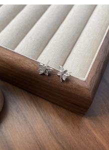 Macro shot of S925 sterling silver dragonfly stud earrings with white micro-pave zircons