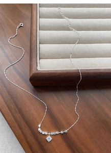 Close-up of S925 sterling silver crushed ice necklace with four-prong zircon pendant