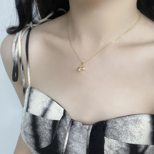 Elegant S925 sterling silver lily of the valley bell pendant necklace on a gold chain