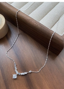 Detailed view of S925 silver necklace featuring a round zircon pendant on a bead chain