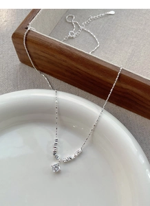 Macro view of S925 sterling silver chain with a sparkling cubic zirconia pendant