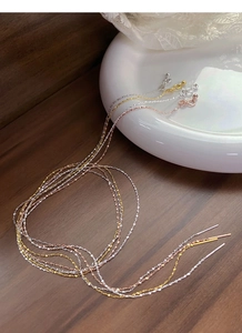 Detailed view of S925 sterling silver ear threads in silver, gold, and rose gold finishes
