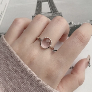 Elegant S925 sterling silver ring featuring a large oval pink gemstone on finger