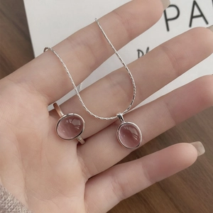 S925 silver jewelry set featuring oval pink gemstone ring and matching pendant necklace