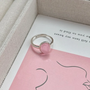 S925 sterling silver adjustable ring with an oval pink gemstone on a decorative card