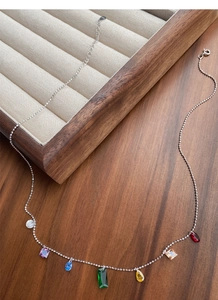 Close-up of S925 sterling silver chain with vibrant colorful zircon stone pendants