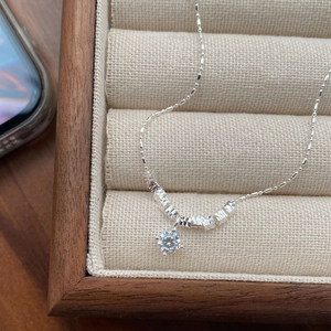 Elegant S925 sterling silver necklace with a sparkling cubic zirconia pendant in a wooden box