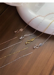 Detailed close-up of S925 sterling silver necklaces in gold, silver, and rose gold finishes