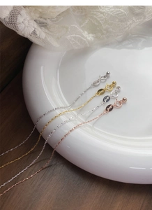 Close-up of S925 sterling silver necklaces showing hallmarked lobster clasps and beads